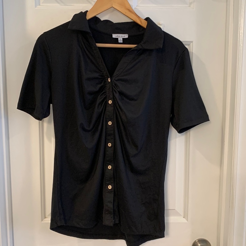 Black collared shirt sleeve shirt with tan buttons